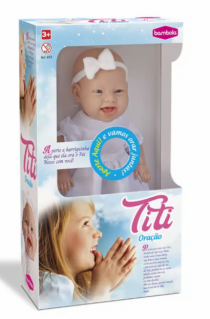 BONECA TITI ORACAO - Distribuidora 12 de Outubro